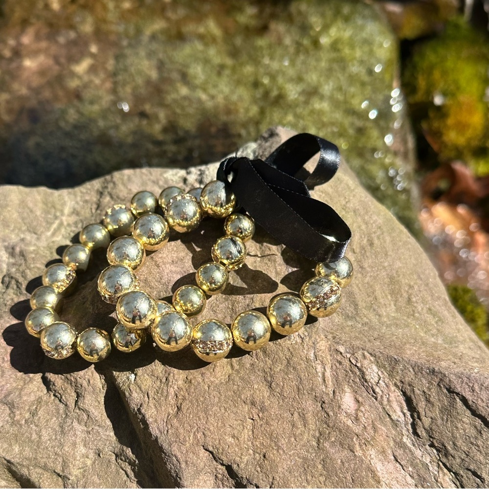 Gorgeous pair of gold beaded bracelets. Cold water creek. Black satin ribbon